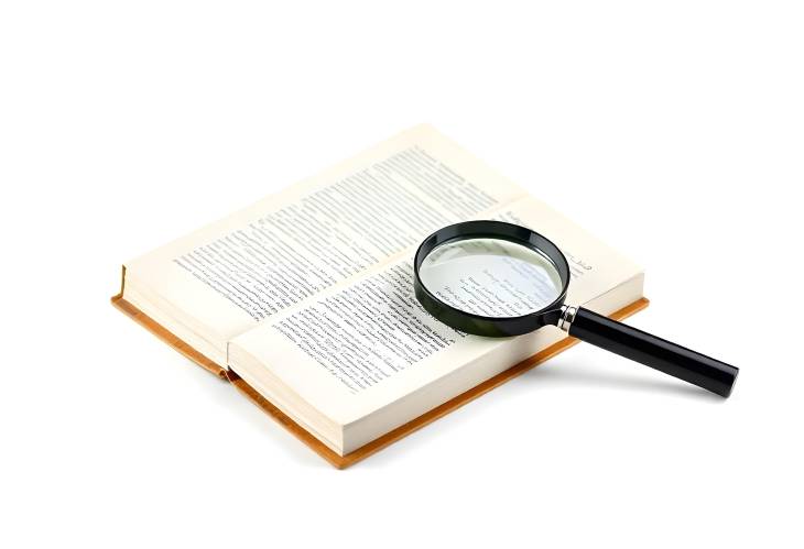 Magnifying Glass and Open Book Isolated on White for Research